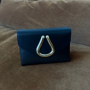 ST. JOHN | Elegant Black Purse with Gold Accent